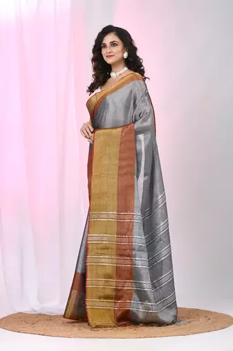 Elegant grey tissue saree with contrasting golden border