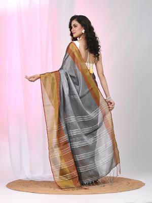 Elegant grey tissue saree with contrasting golden border 3