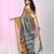 Elegant grey tissue saree with contrasting golden border