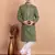 Elegant green kurta pyjama set with yellow thread embroidered geometric pattern & embellished neckline
