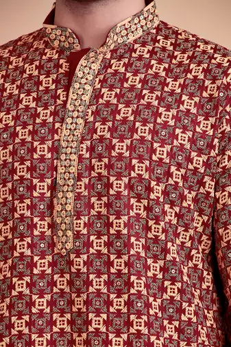 Elegant maroon kurta pyjama set with yellow thread embroidered geometric pattern & embellished neckline