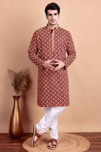 Elegant maroon kurta pyjama set with yellow thread embroidered geometric pattern & embellished neckline