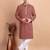 Elegant maroon kurta pyjama set with yellow thread embroidered geometric pattern & embellished neckline