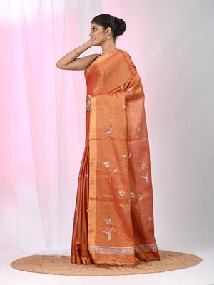 Orange tissue saree with ethnic motifs and golden border 2