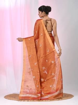 Orange tissue saree with ethnic motifs and golden border 3