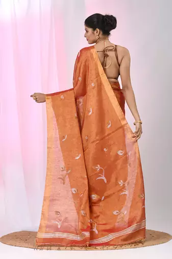 Orange tissue saree with ethnic motifs and golden border
