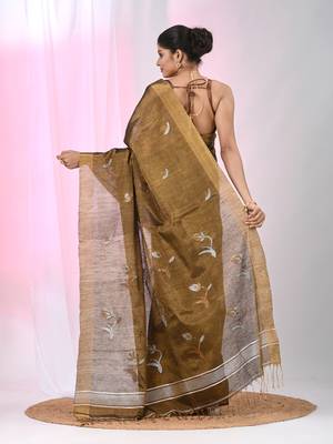 Metallic tissue saree with ethnic motifs and golden border 3