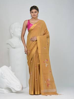 Beige tissue saree with ethnic motifs and golden border 1