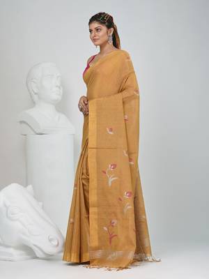 Beige tissue saree with ethnic motifs and golden border 2