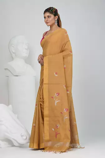 Beige tissue saree with ethnic motifs and golden border