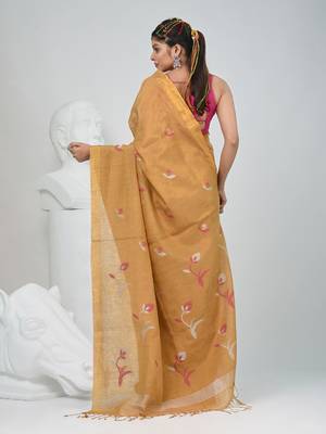 Beige tissue saree with ethnic motifs and golden border 3
