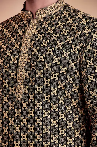 Elegant black kurta with yellow thread embroidered geometric pattern & embellished neckline
