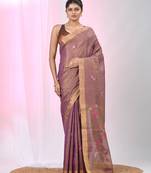 Purple tissue saree with ethnic motifs and golden border
