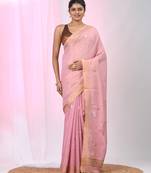Baby pink tissue saree with ethnic motifs and golden border