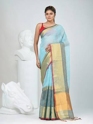 Elegant sky blue and gold linen saree with striped borders 5