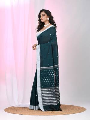 Teal cotton saree with white border and woven patterns 1