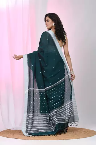 Teal cotton saree with white border and woven patterns