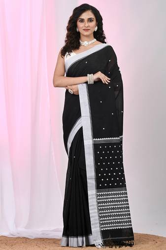 Black cotton saree with white border and woven patterns