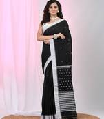 Black cotton saree with white border and woven patterns