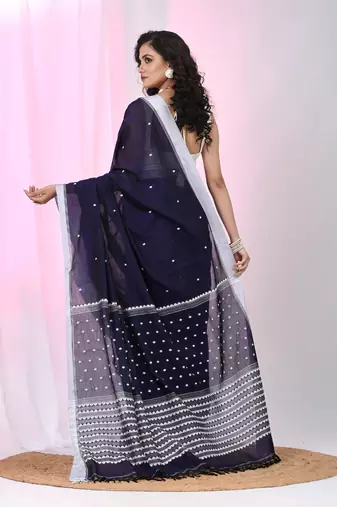Dark purple cotton saree with white border and woven patterns
