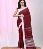 Red cotton saree with white border and woven patterns