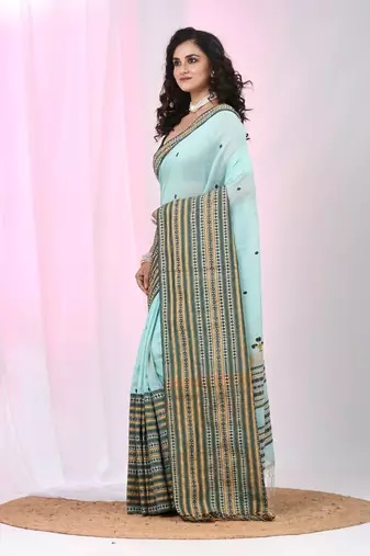 Sea green cotton saree with intricate striped border and tassels