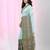 Sea green cotton saree with intricate striped border and tassels