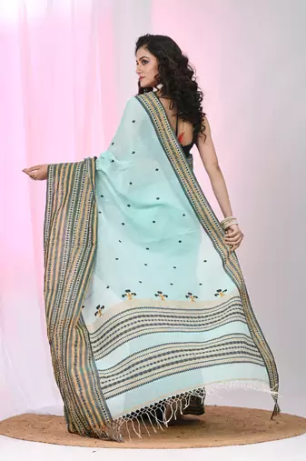 Sea green cotton saree with intricate striped border and tassels
