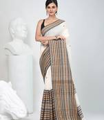 Off white cotton saree with intricate striped border and tassels