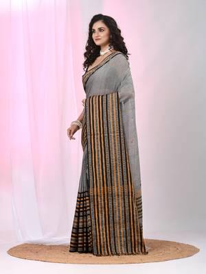 Grey cotton saree with intricate striped border and tassels 2
