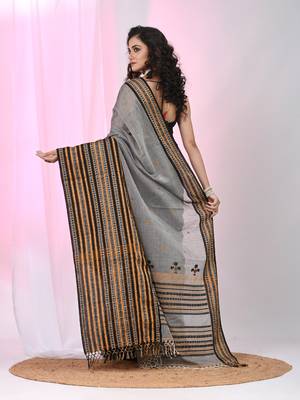 Grey cotton saree with intricate striped border and tassels 3