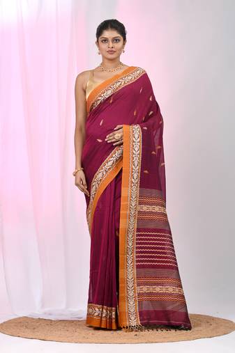 Magenta cotton saree with contrasting yellow border and tassels