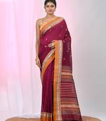 Magenta cotton saree with contrasting yellow border and tassels