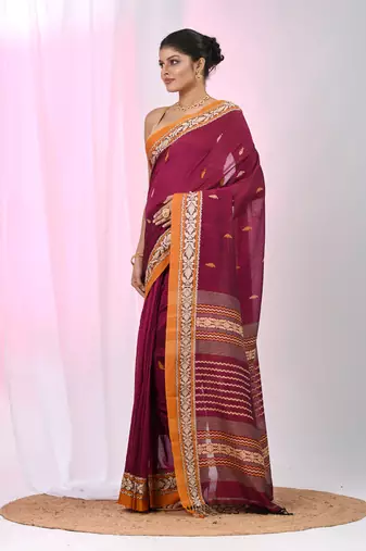 Magenta cotton saree with contrasting yellow border and tassels