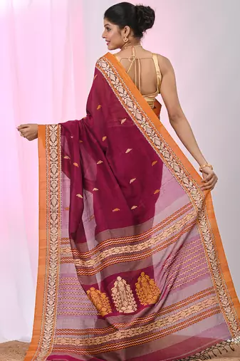 Magenta cotton saree with contrasting yellow border and tassels