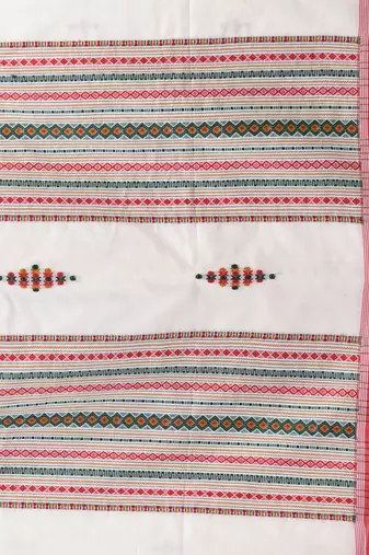 Elegant off white cotton saree with red border & woven motifs