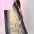Beige and black cotton saree with traditional woven border