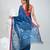 Sapphire blue handwoven cotton saree with pink border and traditional motifs