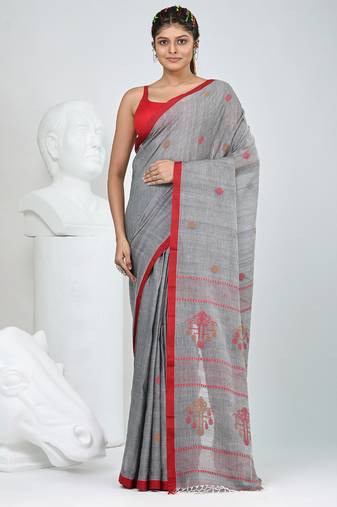 Grey handwoven cotton saree with red border and traditional motifs