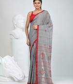 Grey handwoven cotton saree with red border and traditional motifs