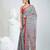 Grey handwoven cotton saree with red border and traditional motifs