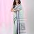 White & black striped cotton saree with green accents and stripe pattern