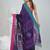 Purple cotton saree with pink and teal border & leaf design