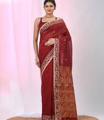 Dark red cotton saree with beige border and traditional woven pallu