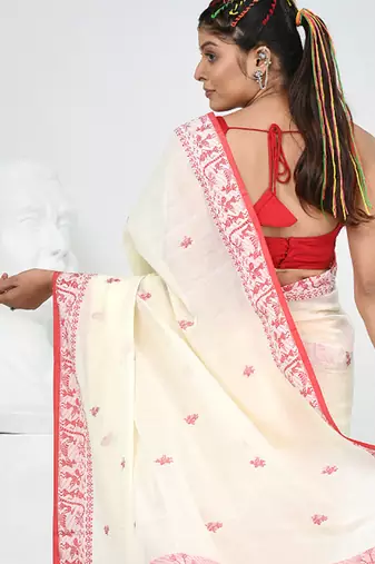 Off white cotton saree with beige border and traditional woven pallu