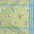 Light green cotton saree with bird motifs and blue stripes