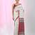 Elegant ecru cotton saree with red and green diamond motifs