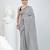 Elegant grey cotton saree with sequin embellishments and pom pom