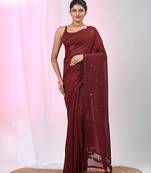 Elegant maroon cotton saree with sequin embellishments and pom pom