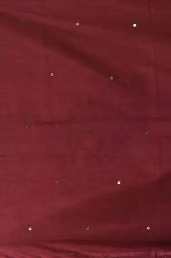 Elegant maroon cotton saree with sequin embellishments and pom pom